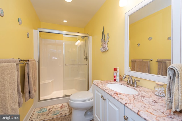 bathroom with toilet, tile patterned floors, walk in shower, and vanity