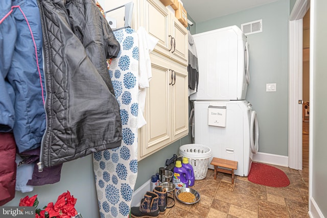 interior space featuring stacked washer / dryer