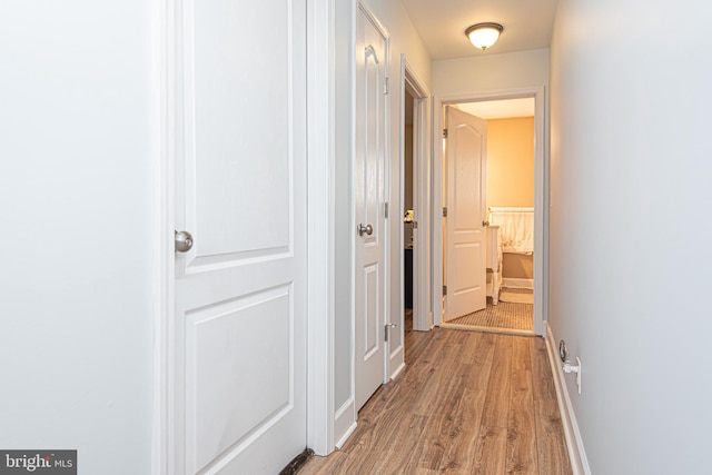 corridor featuring light wood-type flooring