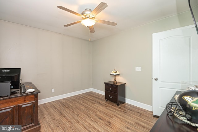 office space with light wood-type flooring and ceiling fan