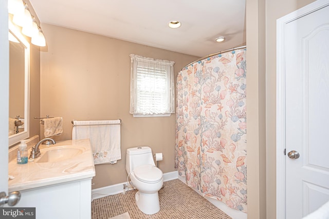 bathroom with vanity, tile patterned flooring, toilet, and curtained shower