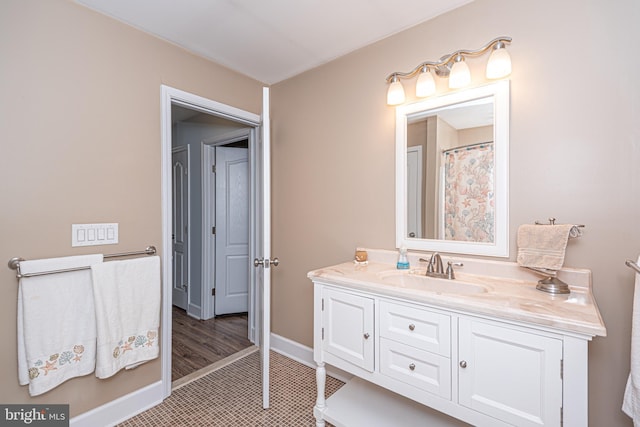 bathroom with tile patterned flooring and vanity