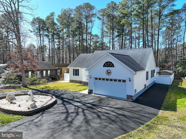 view of property exterior with a yard and a garage