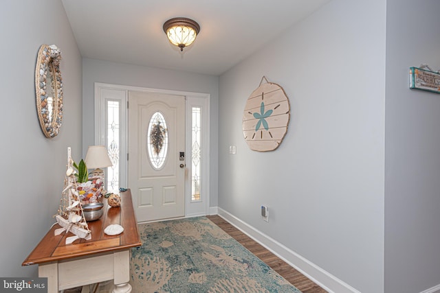 foyer entrance with hardwood / wood-style floors