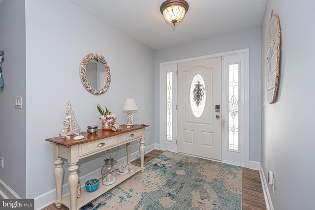 entrance foyer featuring dark hardwood / wood-style flooring and plenty of natural light