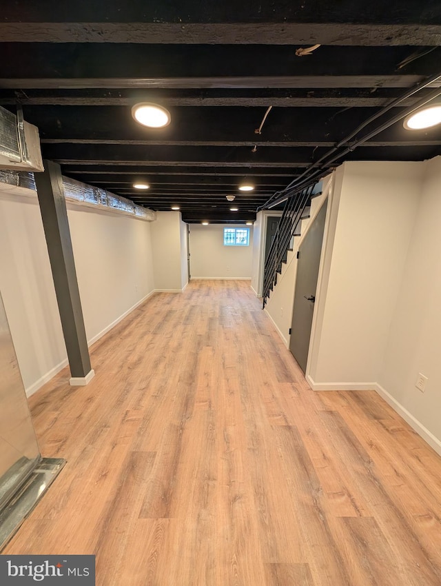 basement featuring light hardwood / wood-style flooring