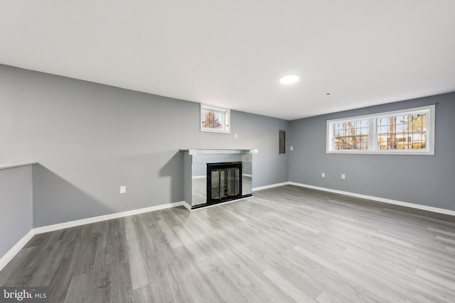 unfurnished living room featuring light hardwood / wood-style flooring