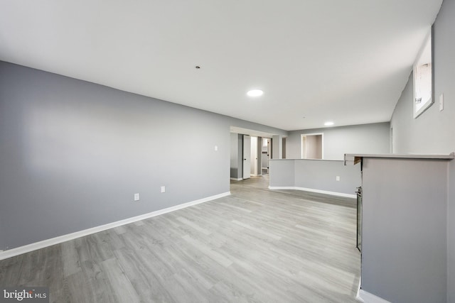 unfurnished living room with light hardwood / wood-style flooring