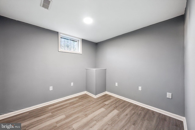 unfurnished room with light wood-type flooring