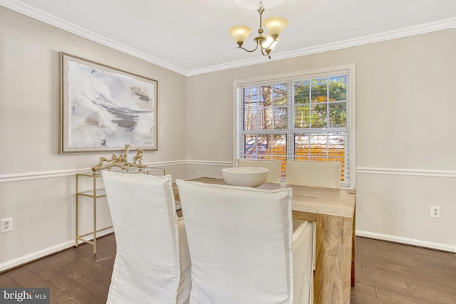 dining area featuring ornamental molding, dark wood-type flooring, and a chandelier