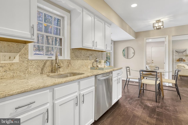 kitchen with white cabinetry, dark hardwood / wood-style floors, dishwasher, and sink