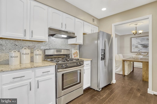 kitchen with pendant lighting, white cabinetry, backsplash, stainless steel appliances, and dark hardwood / wood-style floors