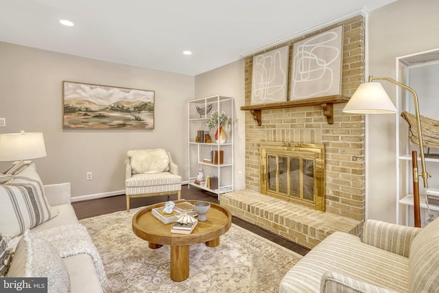 living room with hardwood / wood-style floors and a fireplace