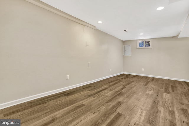 basement featuring hardwood / wood-style floors