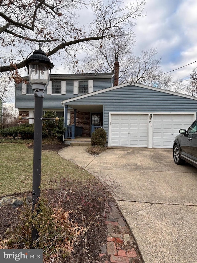 view of front property with a front yard and a garage