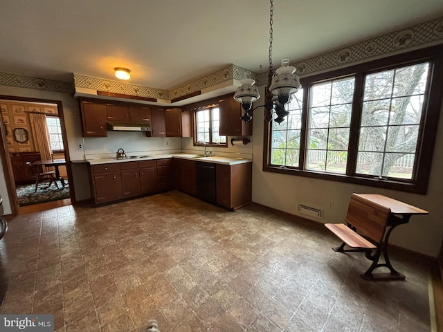 kitchen with dishwasher, a chandelier, sink, dark brown cabinets, and decorative light fixtures