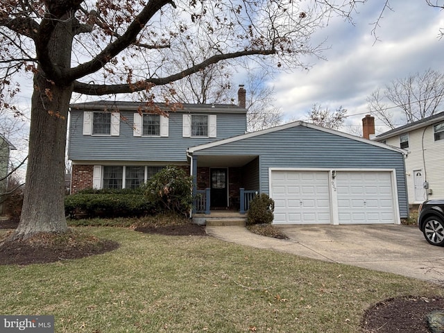 view of front of house featuring a front lawn and a garage