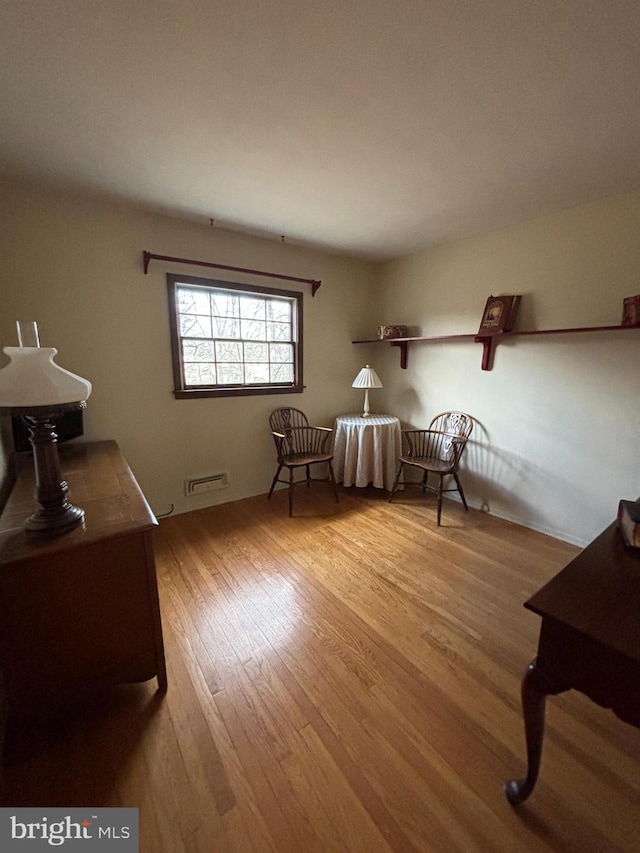 sitting room featuring light hardwood / wood-style floors