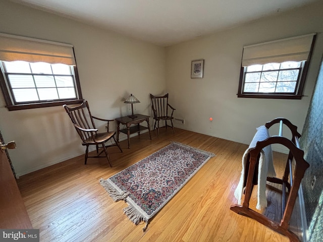 sitting room with hardwood / wood-style flooring