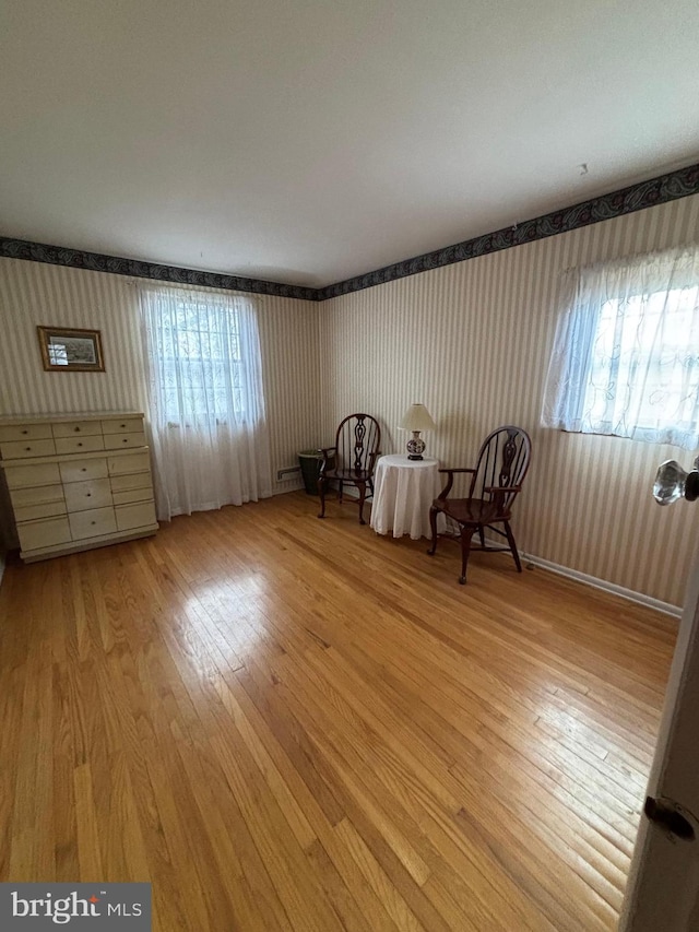 unfurnished room with light wood-type flooring