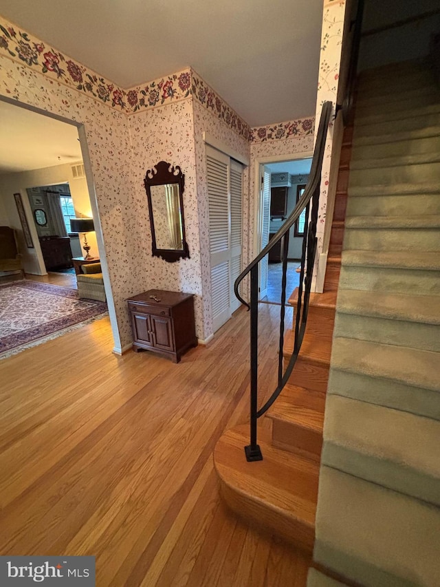 staircase featuring hardwood / wood-style floors