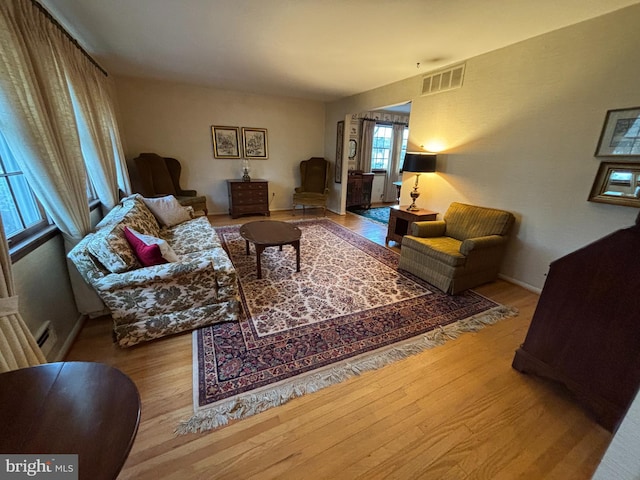 living room with light hardwood / wood-style floors