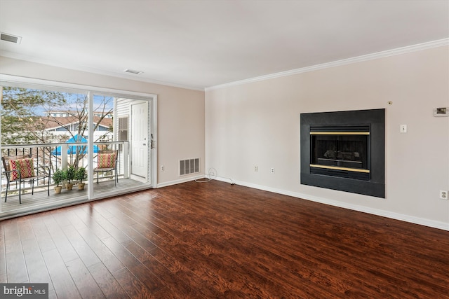 unfurnished living room with hardwood / wood-style floors and ornamental molding