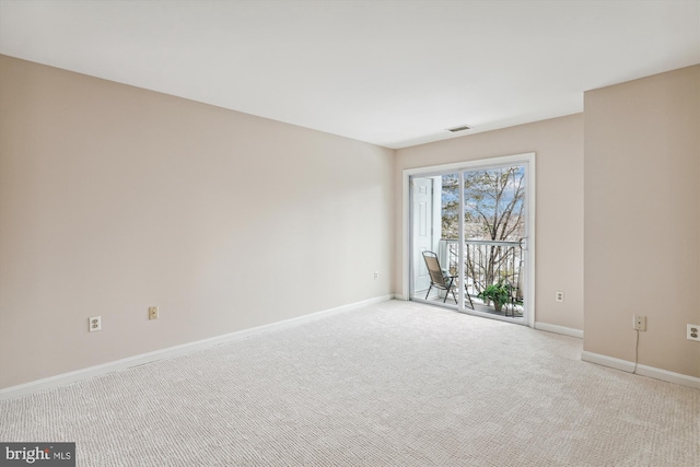 unfurnished room with light colored carpet