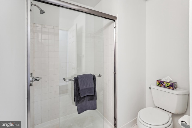 bathroom with toilet and walk in shower