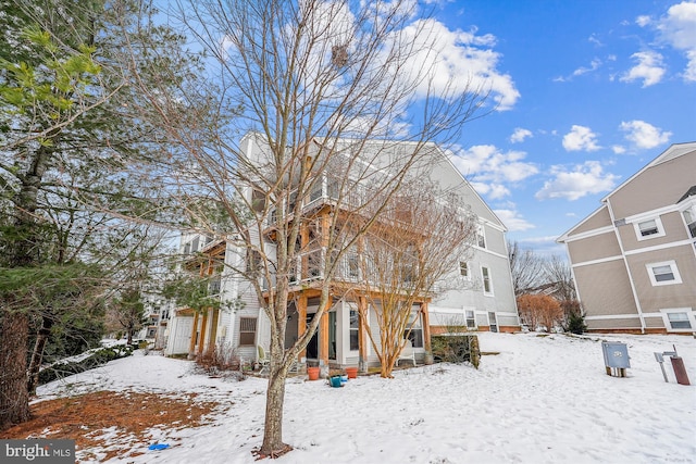 view of snow covered house