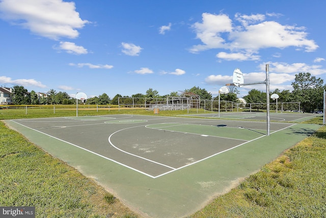 view of sport court featuring a yard