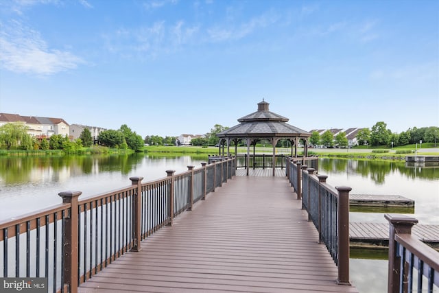 view of dock with a water view and a gazebo