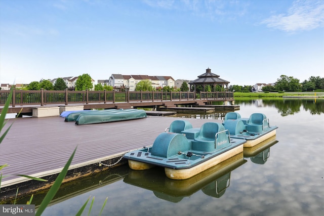 view of dock featuring a water view and a gazebo