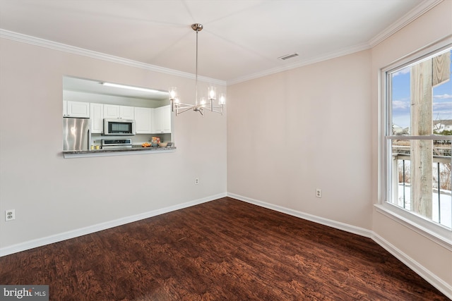 unfurnished dining area with dark hardwood / wood-style floors, a chandelier, crown molding, and plenty of natural light