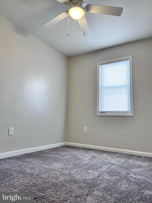 carpeted empty room featuring ceiling fan