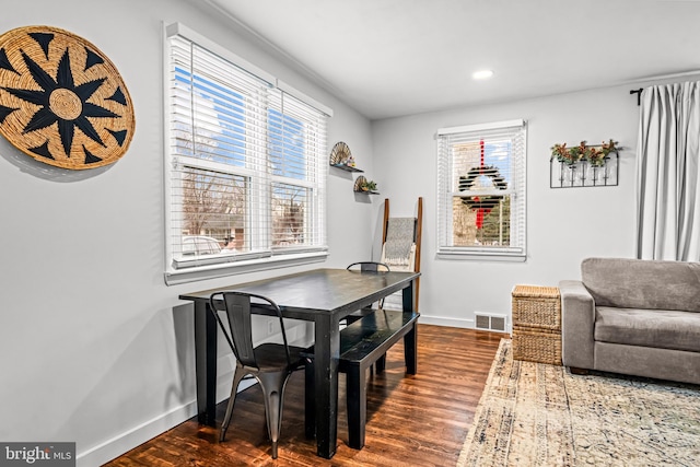 dining area featuring dark hardwood / wood-style flooring