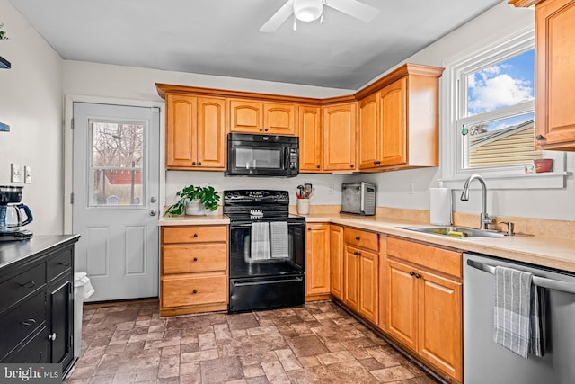 kitchen featuring sink, ceiling fan, and black appliances