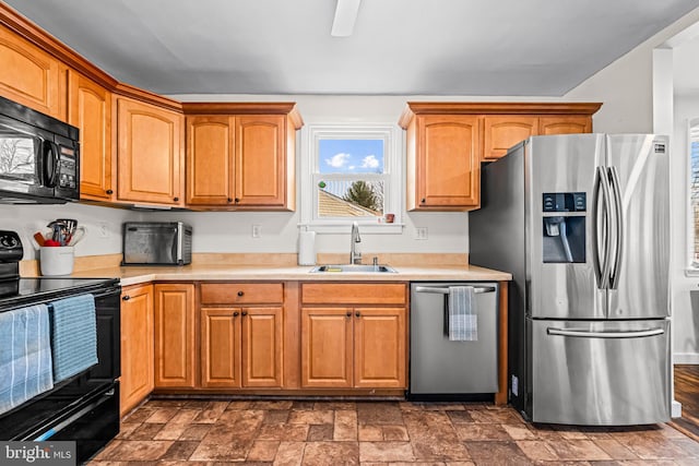 kitchen featuring black appliances and sink