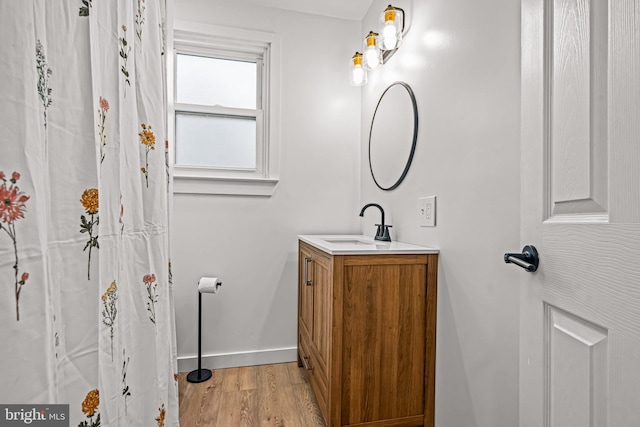 bathroom featuring vanity and hardwood / wood-style flooring