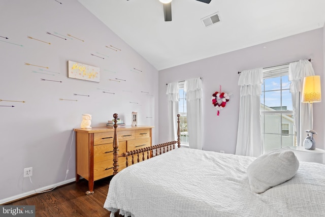 bedroom with vaulted ceiling, ceiling fan, and dark hardwood / wood-style flooring