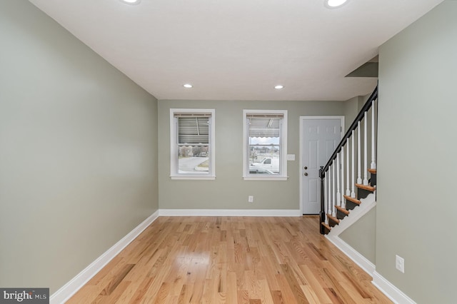 foyer entrance with light wood-type flooring