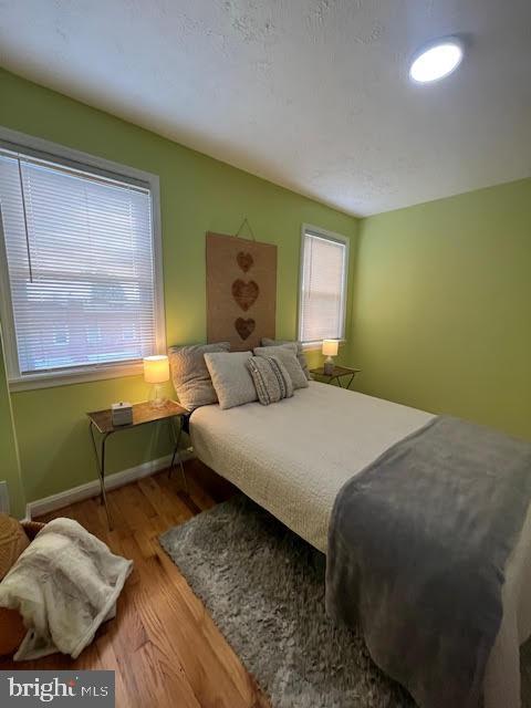 bedroom featuring light wood-type flooring