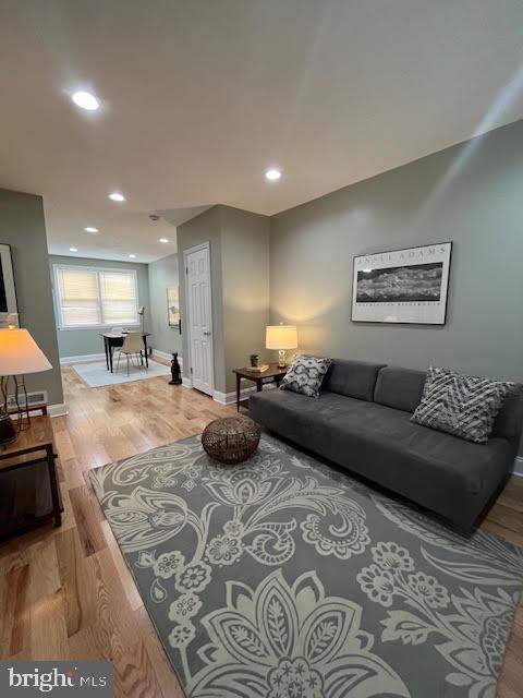 living room with hardwood / wood-style flooring