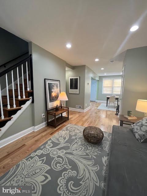 living room with light hardwood / wood-style flooring