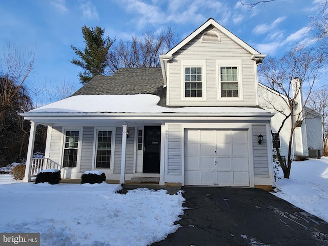 front facade with cooling unit and a garage