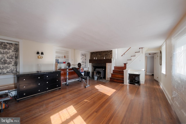 interior space featuring dark hardwood / wood-style floors and built in shelves