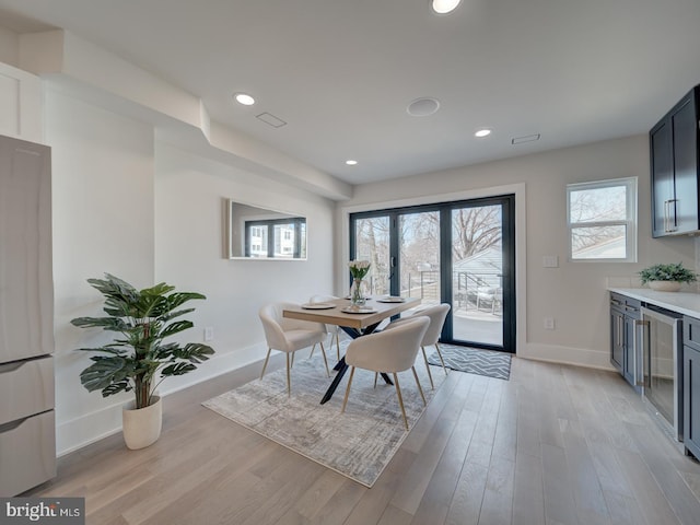 dining space featuring light wood-type flooring