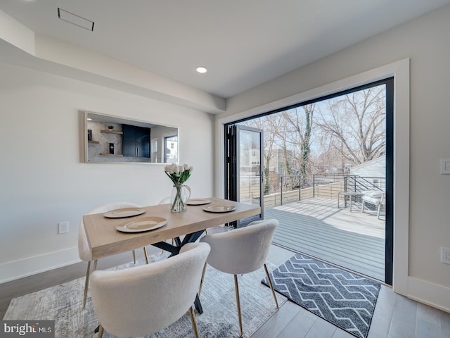 dining space featuring hardwood / wood-style floors