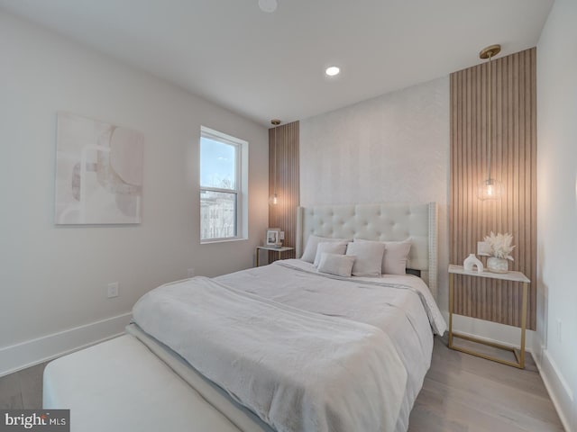 bedroom with hardwood / wood-style flooring