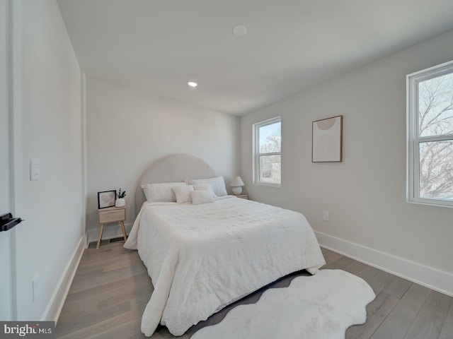 bedroom with wood-type flooring